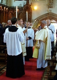 The sign of the cross is used at the reading of the Gospel.